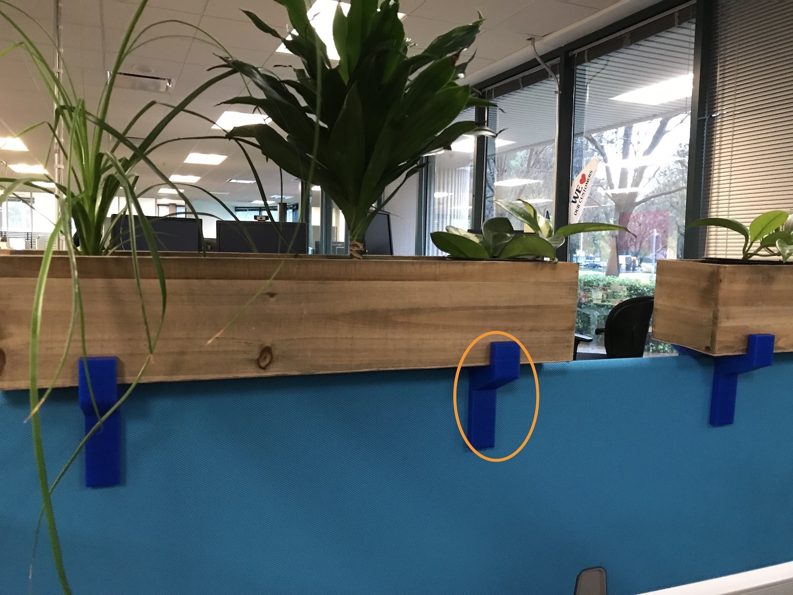 Planter Bracket: attach a planter atop a cubicle partition
