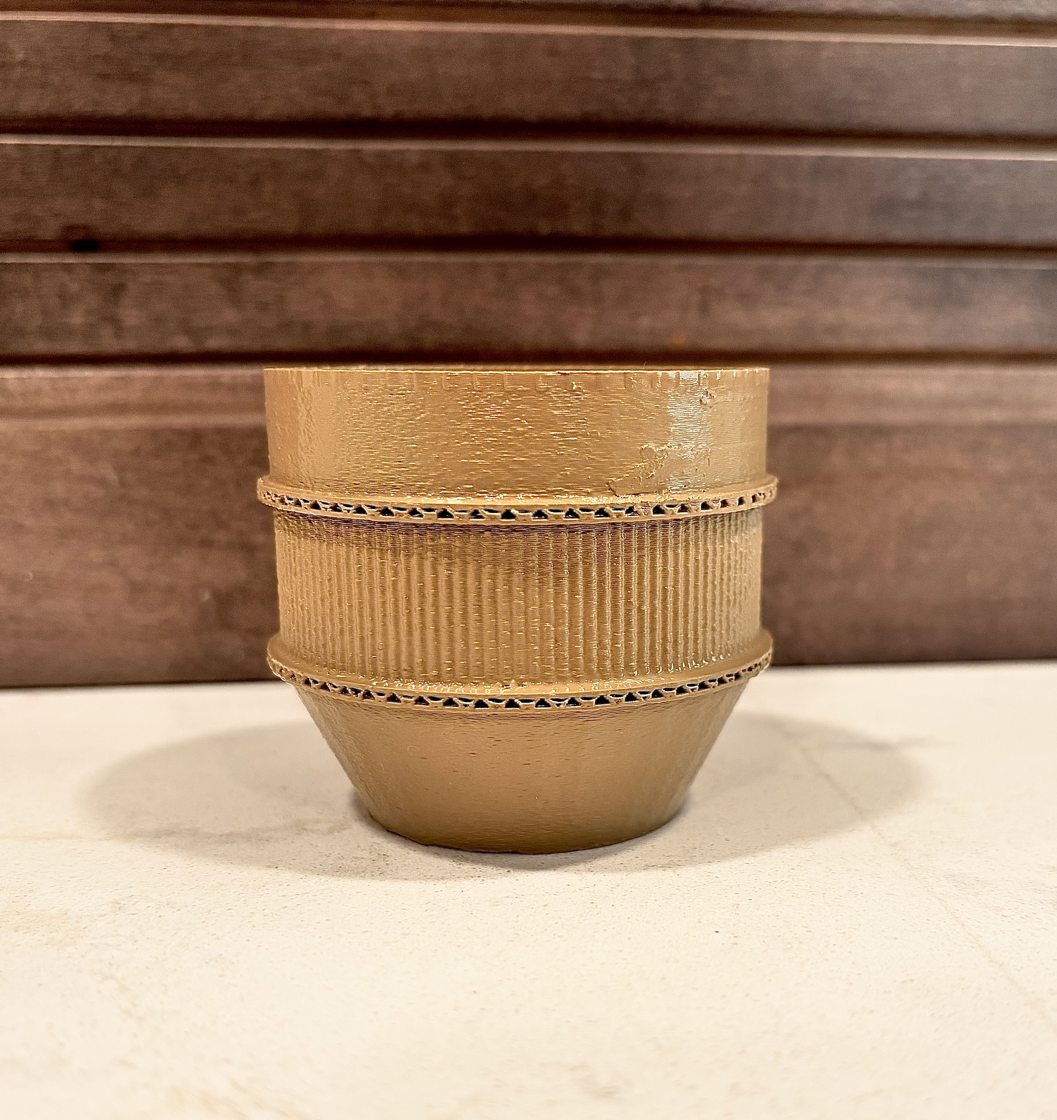 mini pot that looks like cardboard.