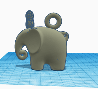 Mini elephant key chain with a pennut.