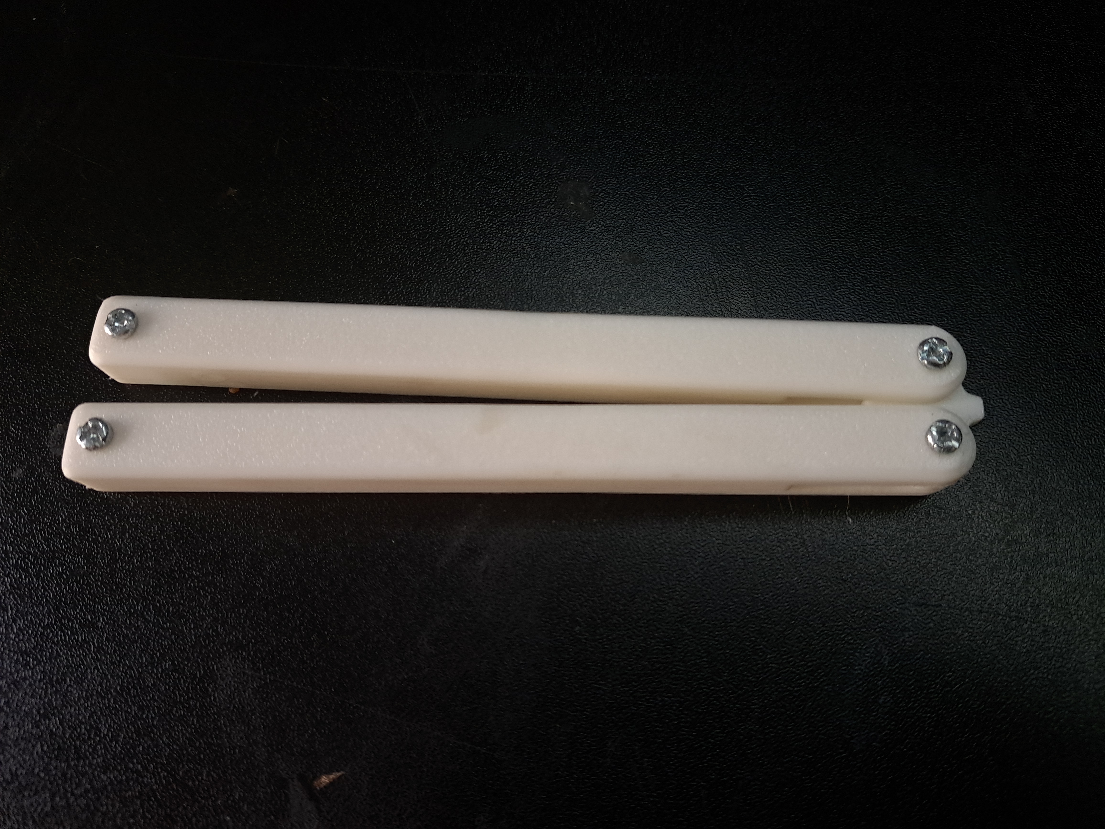 no blade version of Squiddy Style Balisong Trainer by kenny