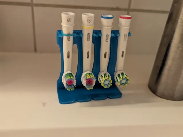 Oral-B electric toothbrush head stand.