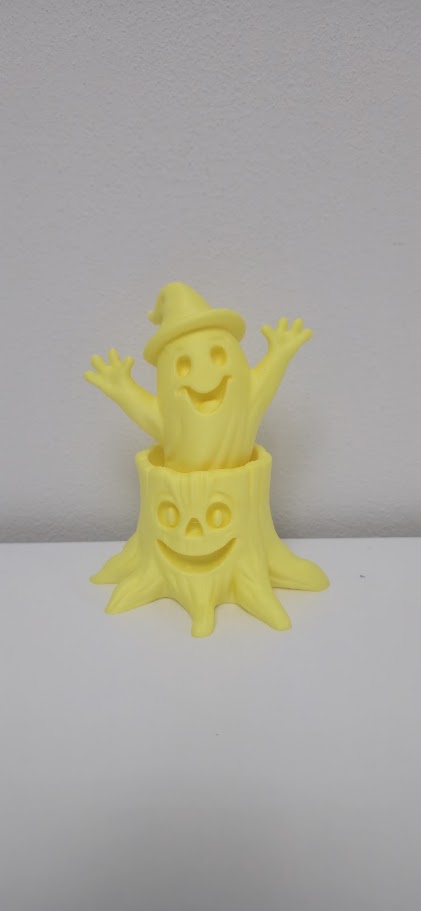 Happy Ghost in a Pumpkin Stump