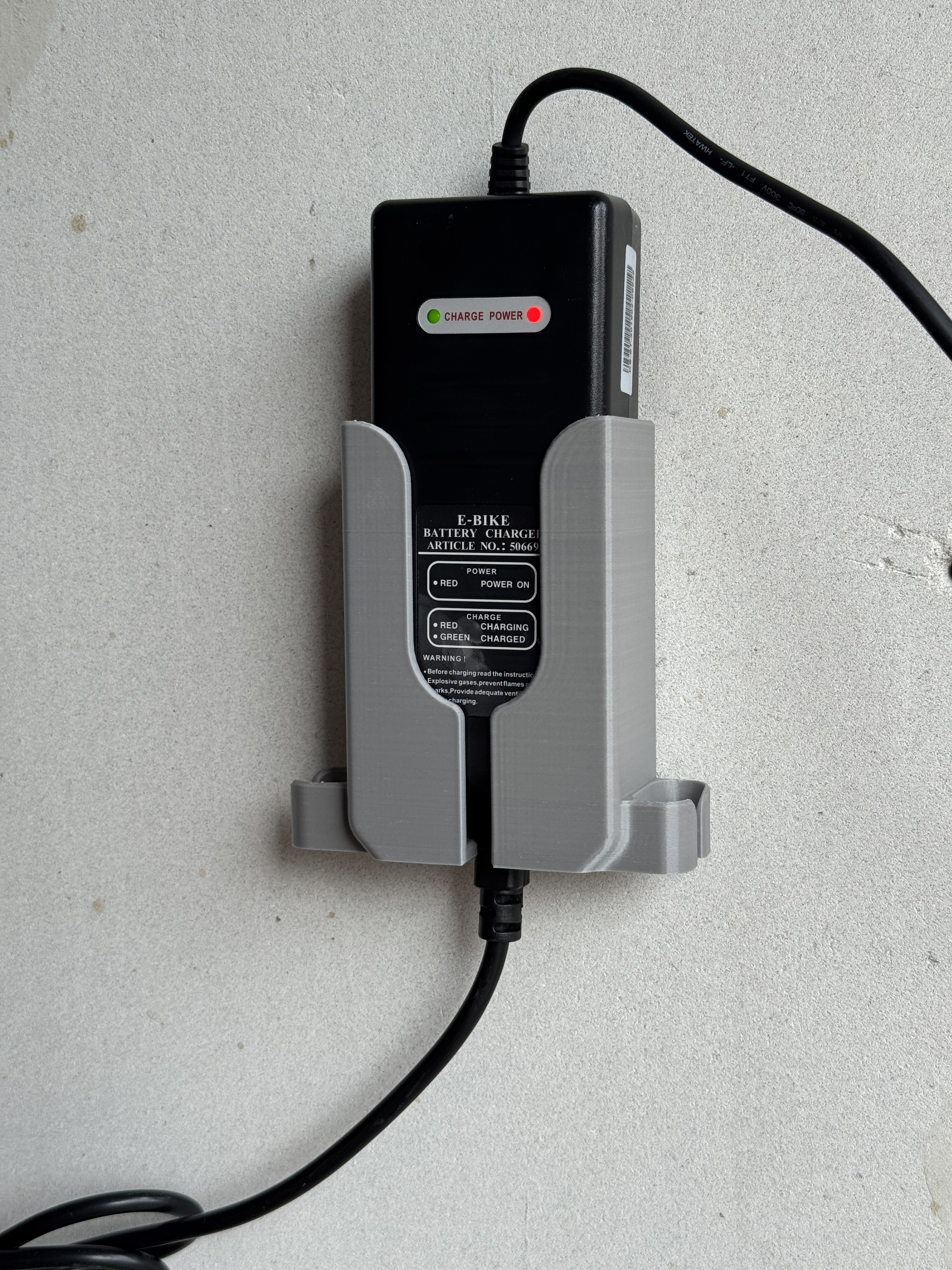 Pointer e-bike charger holder