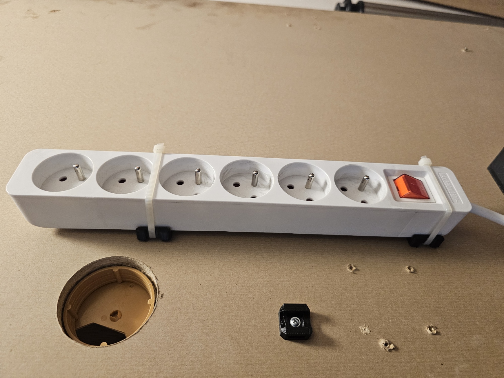 Electrical extension cord holder under desk under table 40-55mm wide
