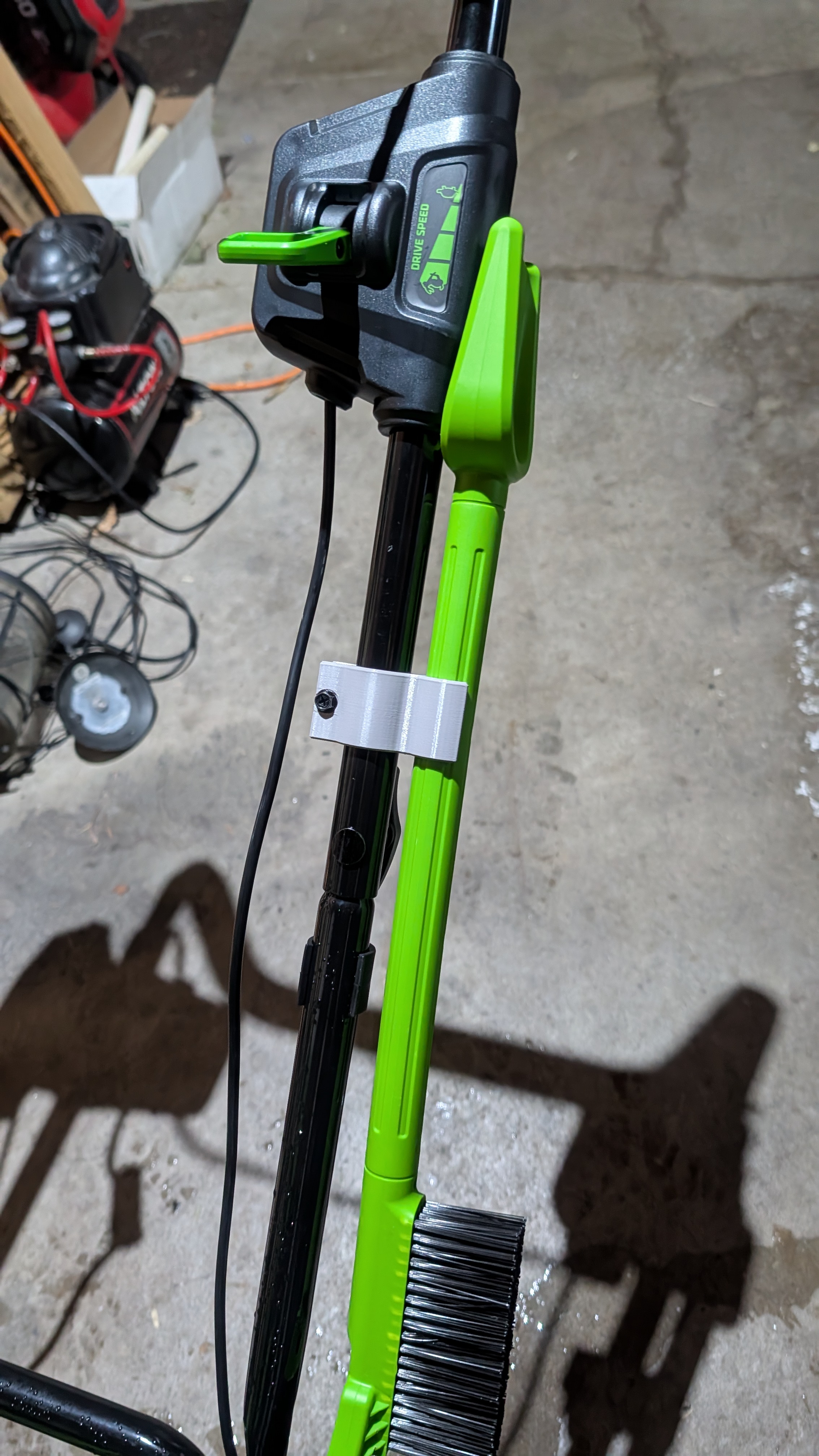 Brush holder for Greenworks 22" snow blower