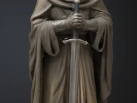 Cloaked man holding a sword wall mounted