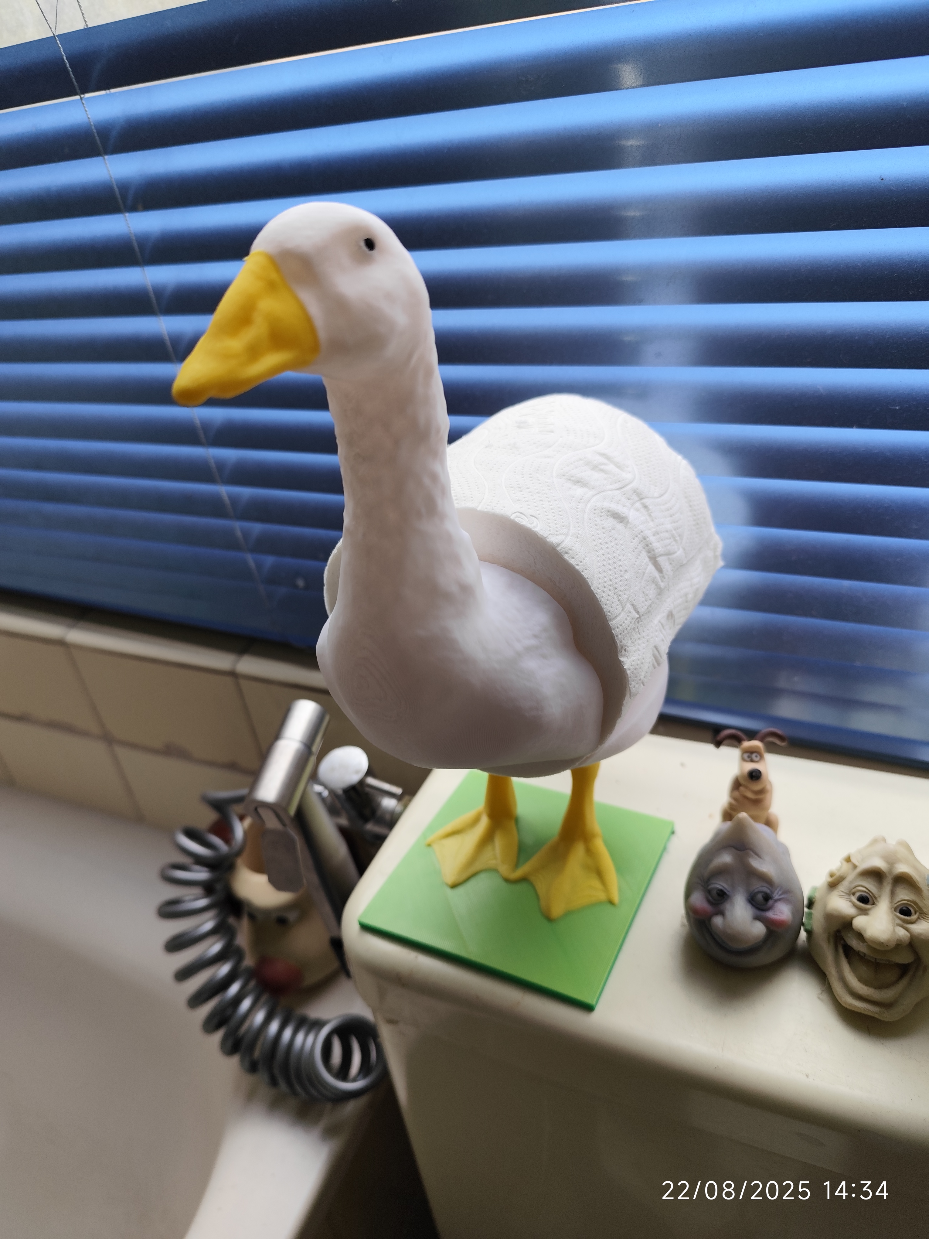Goose (or ostrich) toilet roll stand