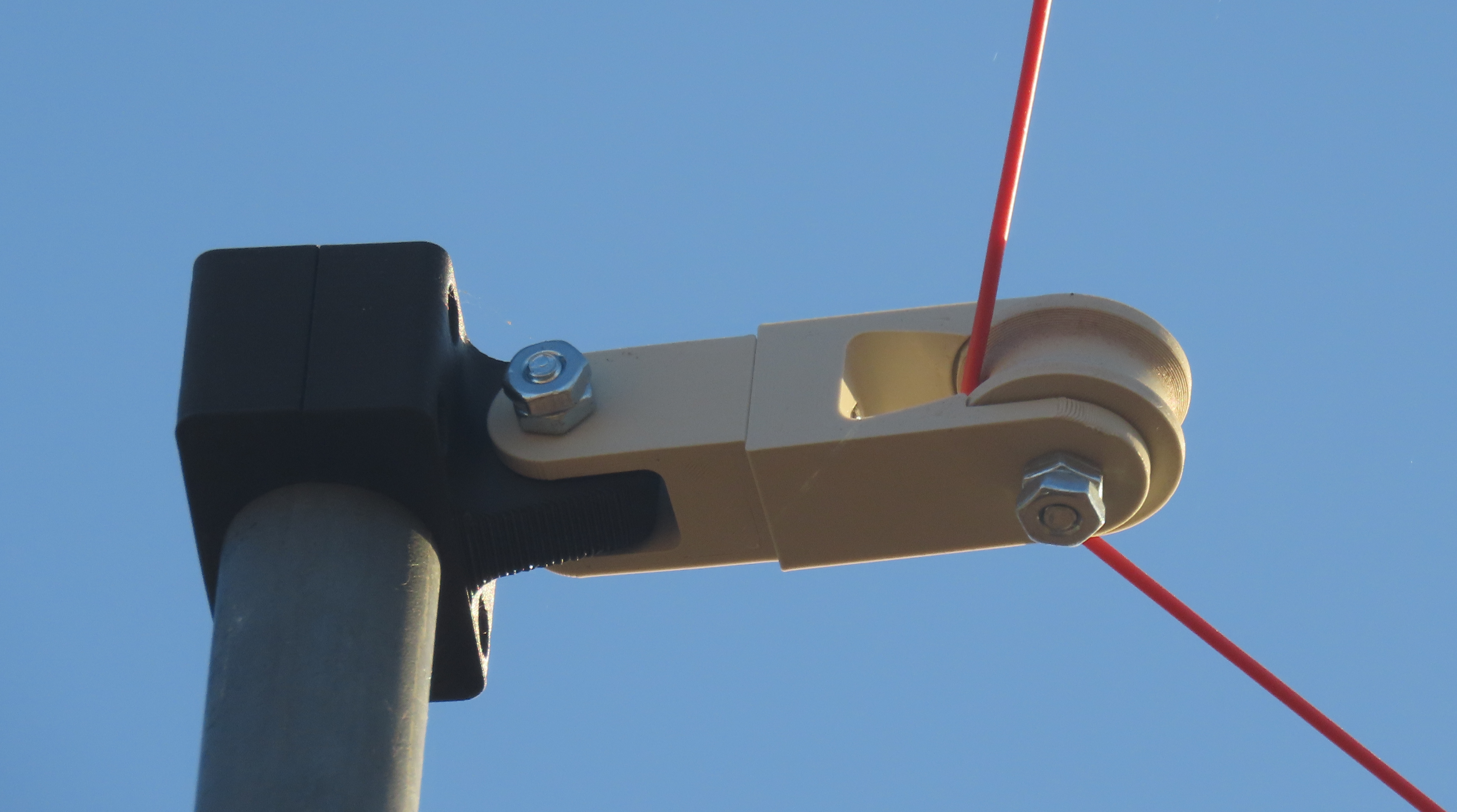 A jam proof pulley for antenna masts or other projects. Includes clamps for Max Gain Systems masts and 1" O.D. US conduit.