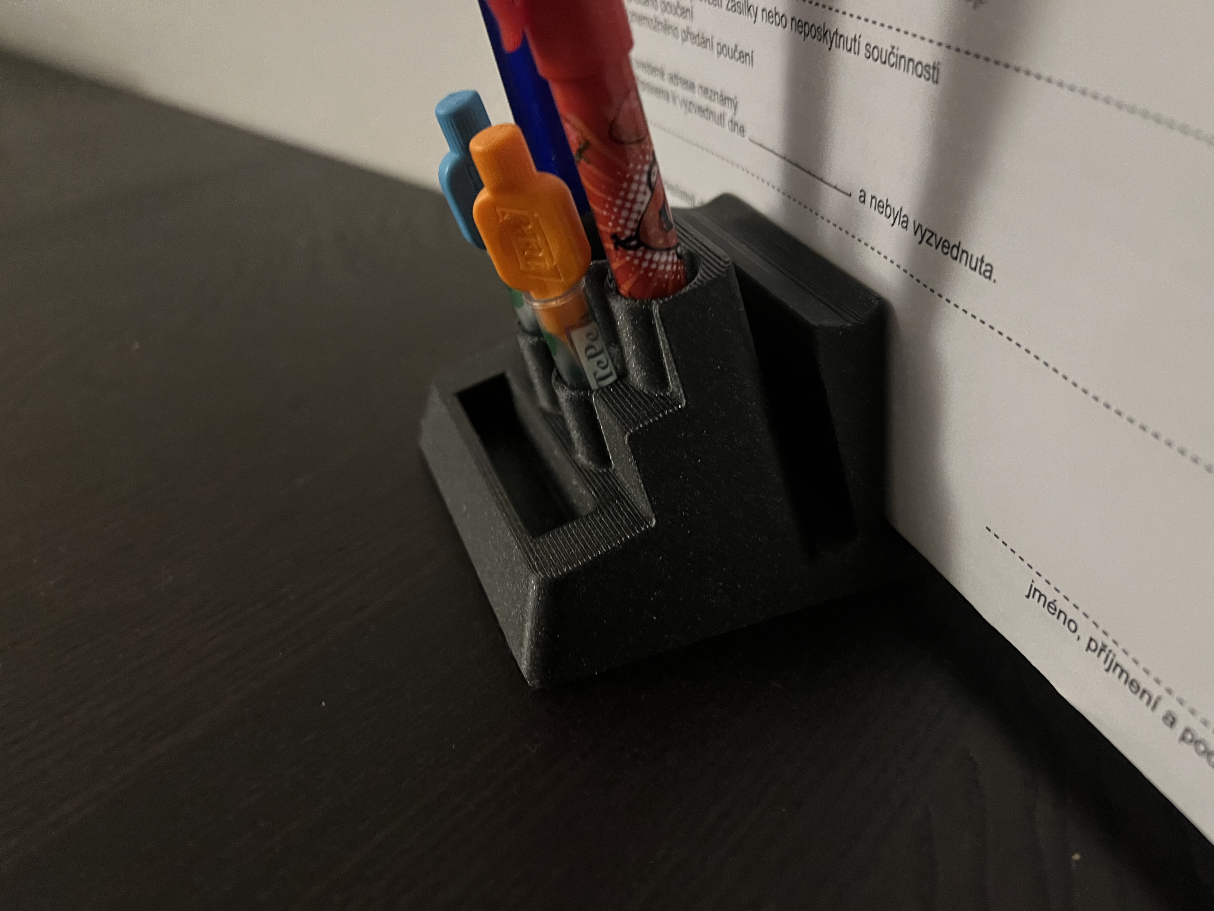 Table Paper and pencils/pen holder