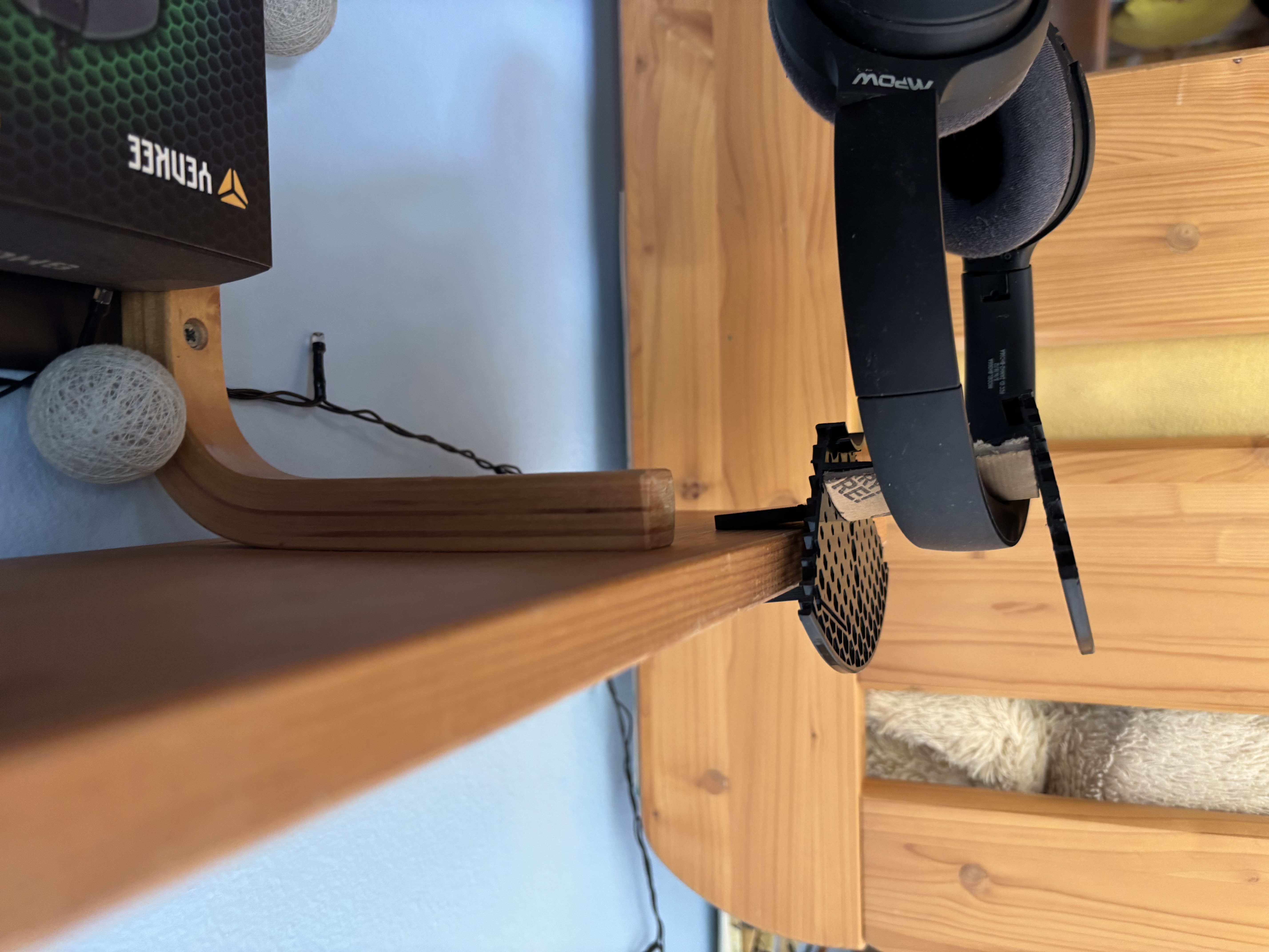 Headphone holder on the shelf.