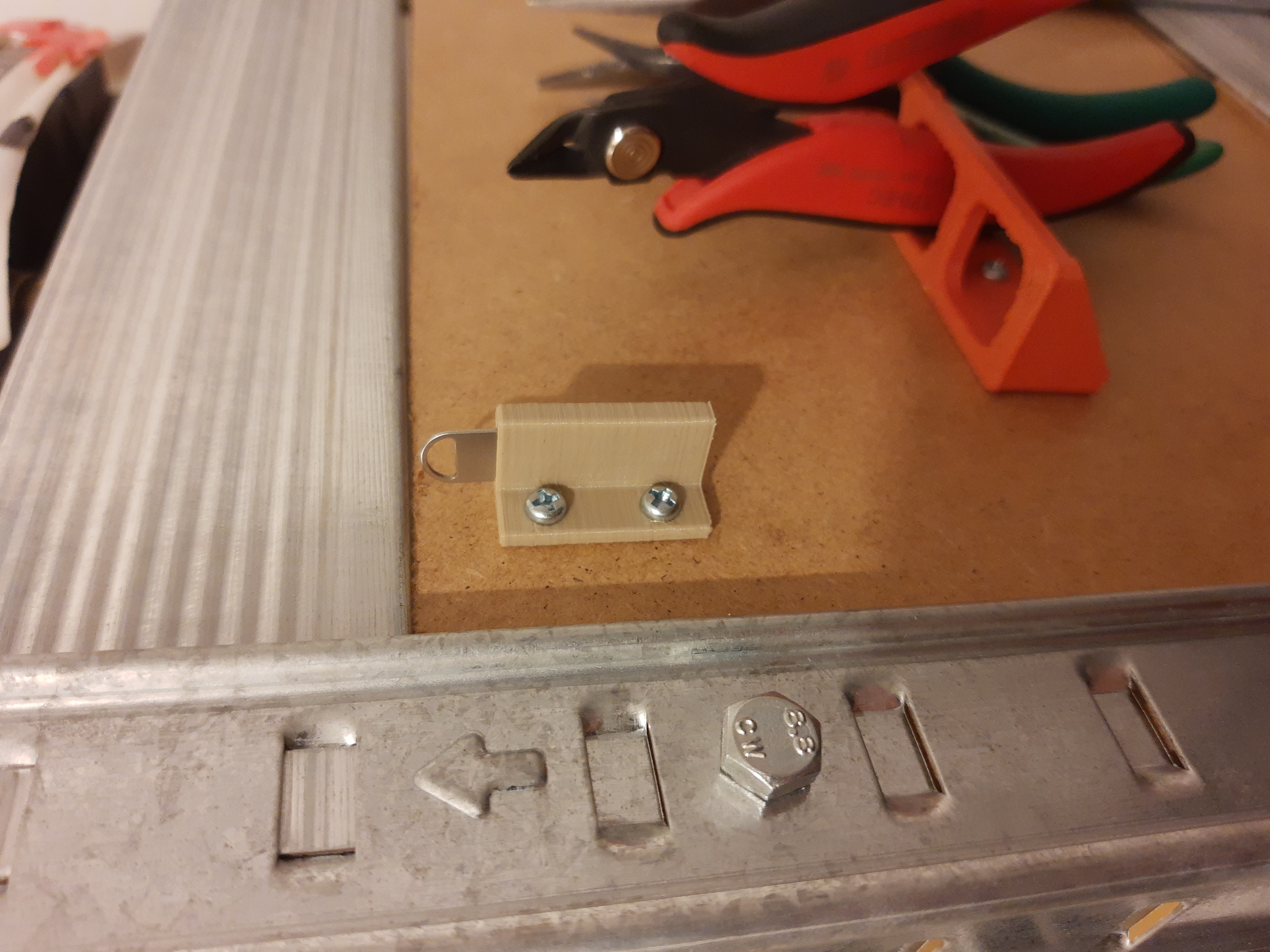 SIM ejector pin holder