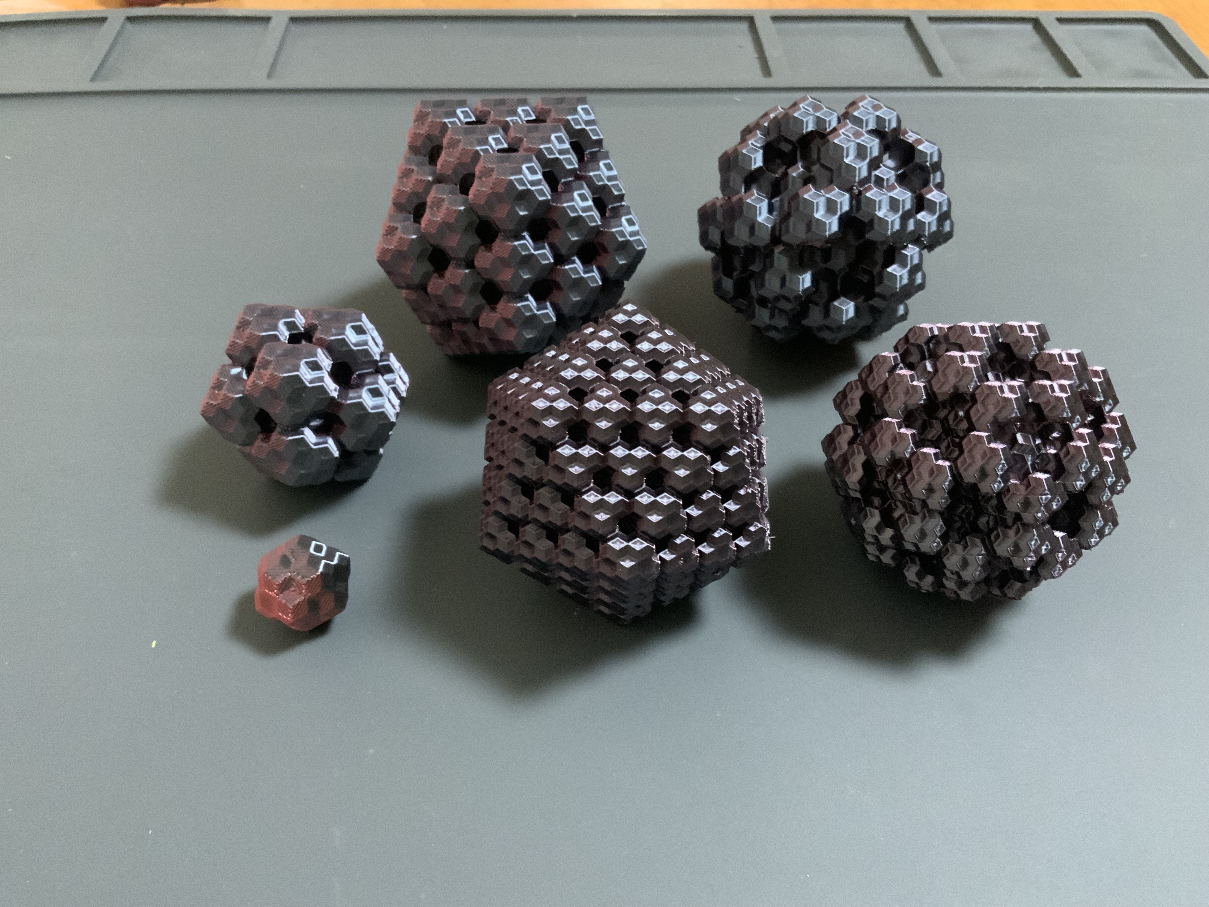 Cluster of rhombic icosahedra and rhombic hexecontahedra