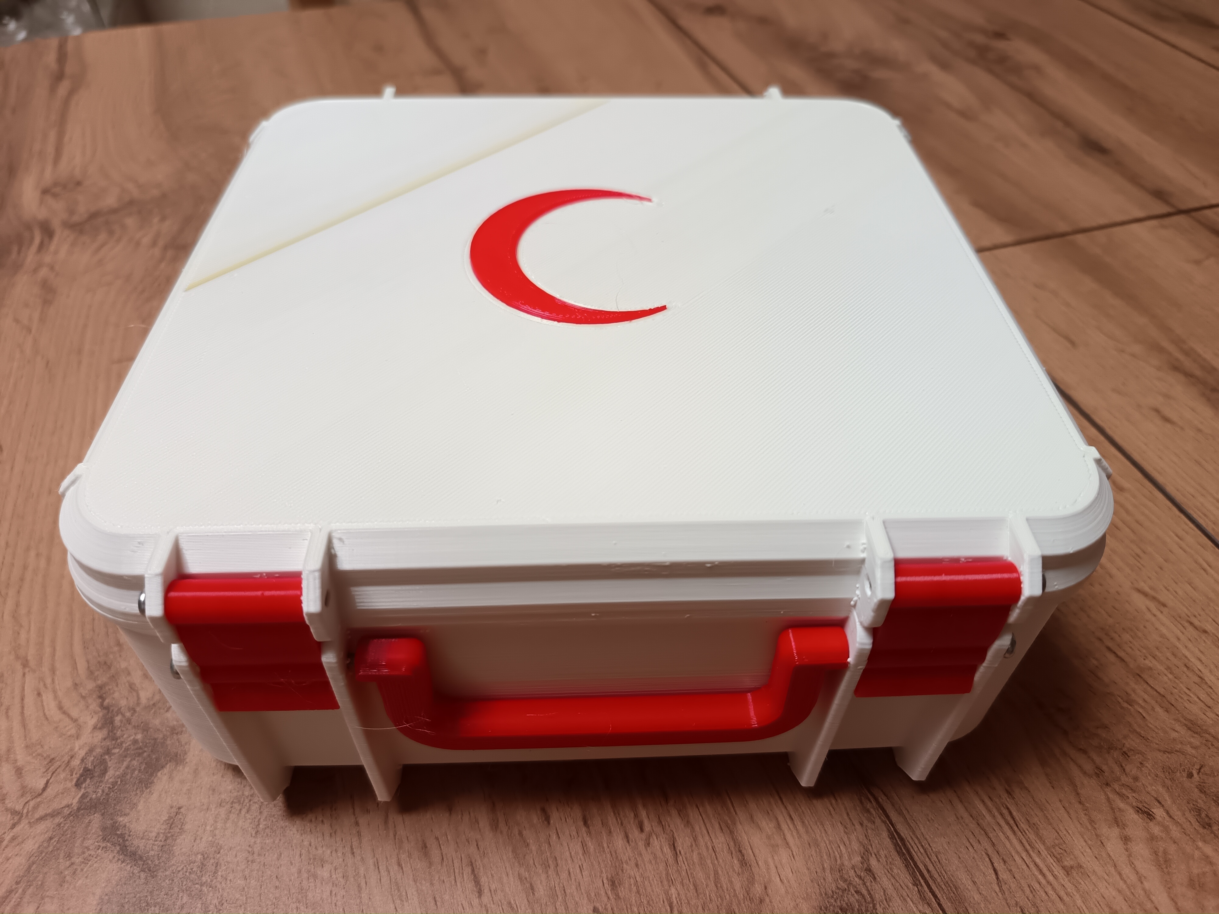 First aid kit with crescent