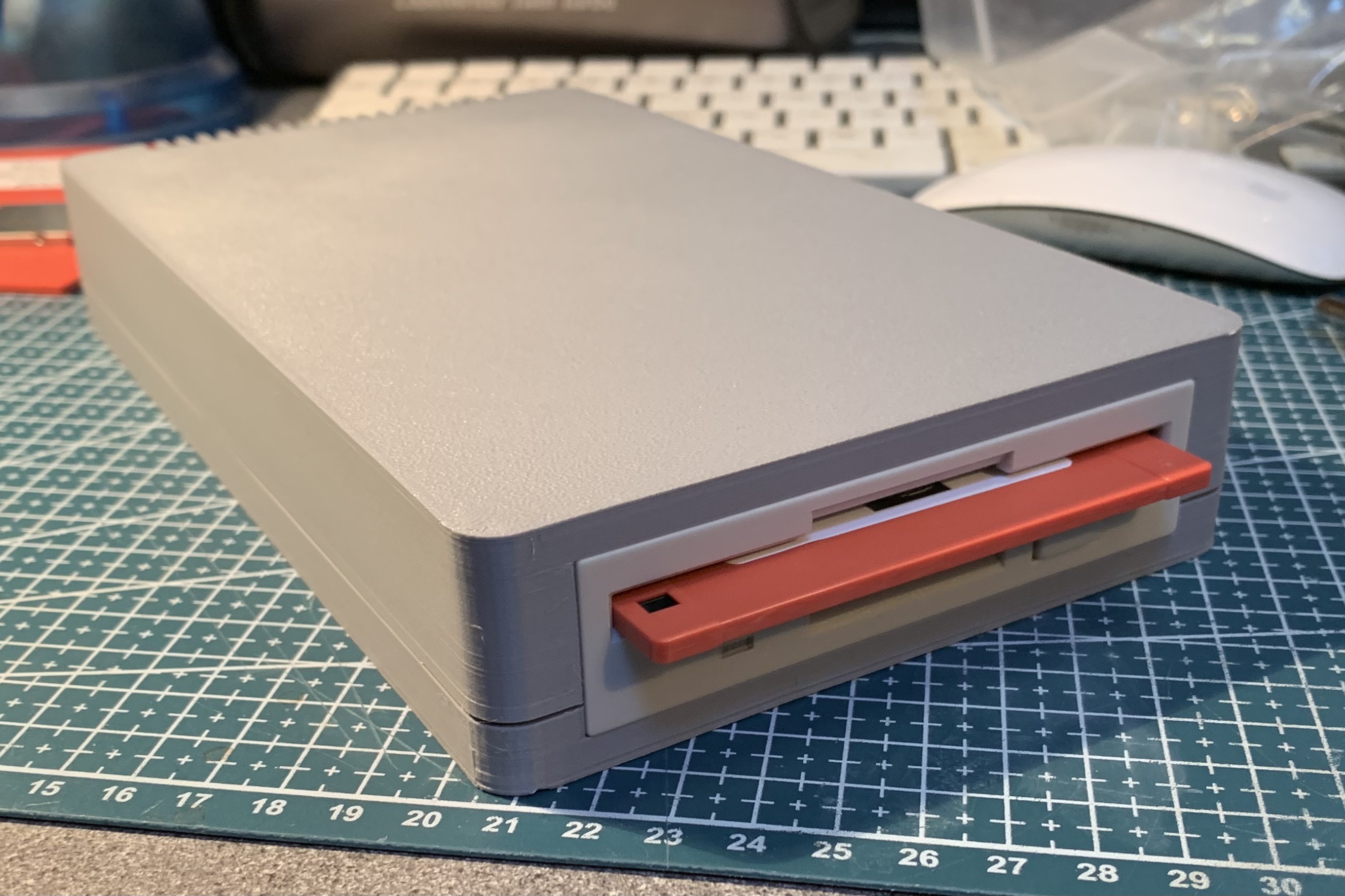 Slimline enclosure for Greaseweazle 4.1 and 3.5-inch floppy disk drive.