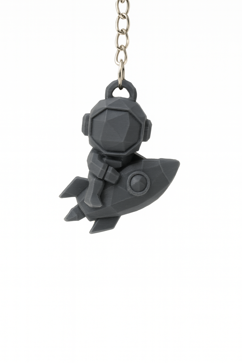 Cute spaceman riding a Rocket KEYCHAIN