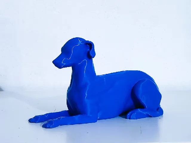 Greyhound seated sculpture