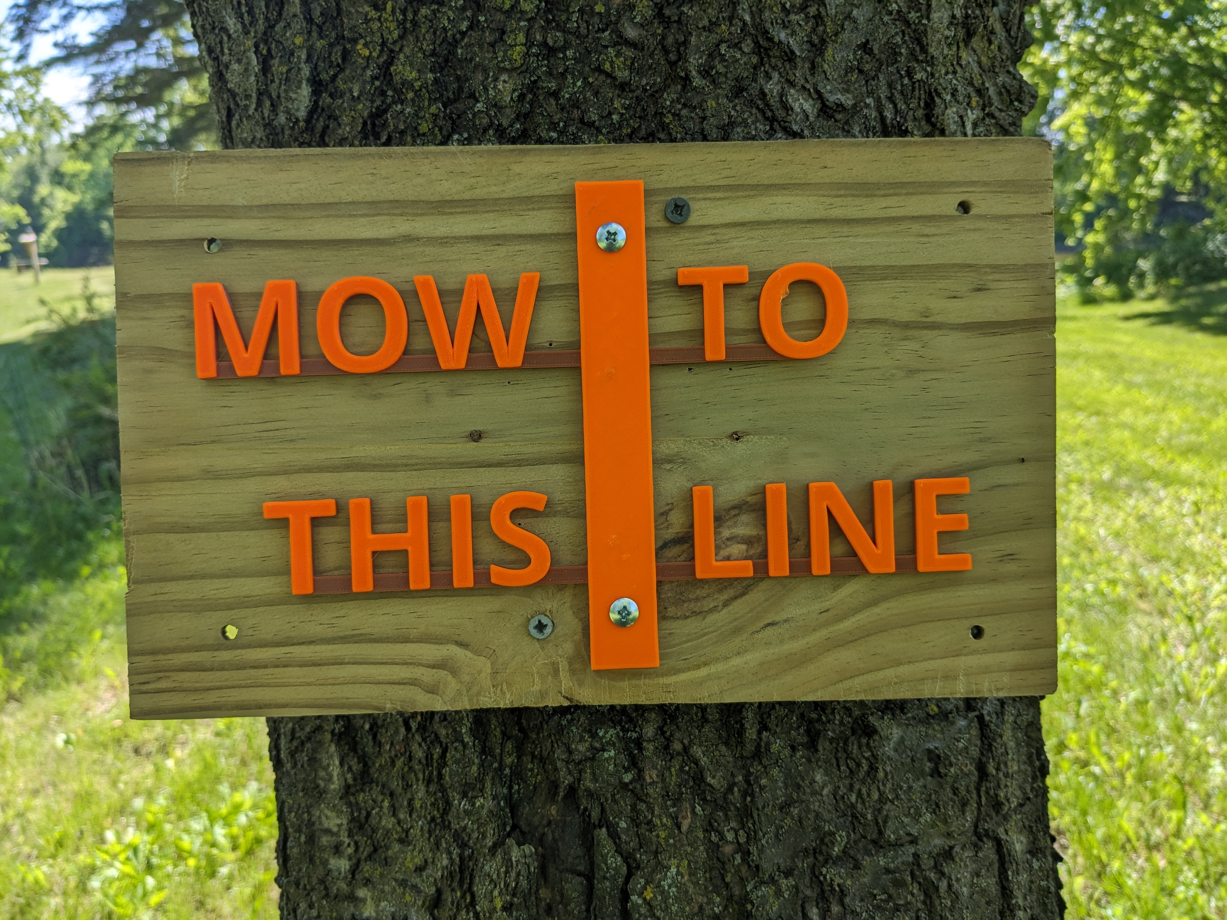 Sign : MOW TO THIS LINE