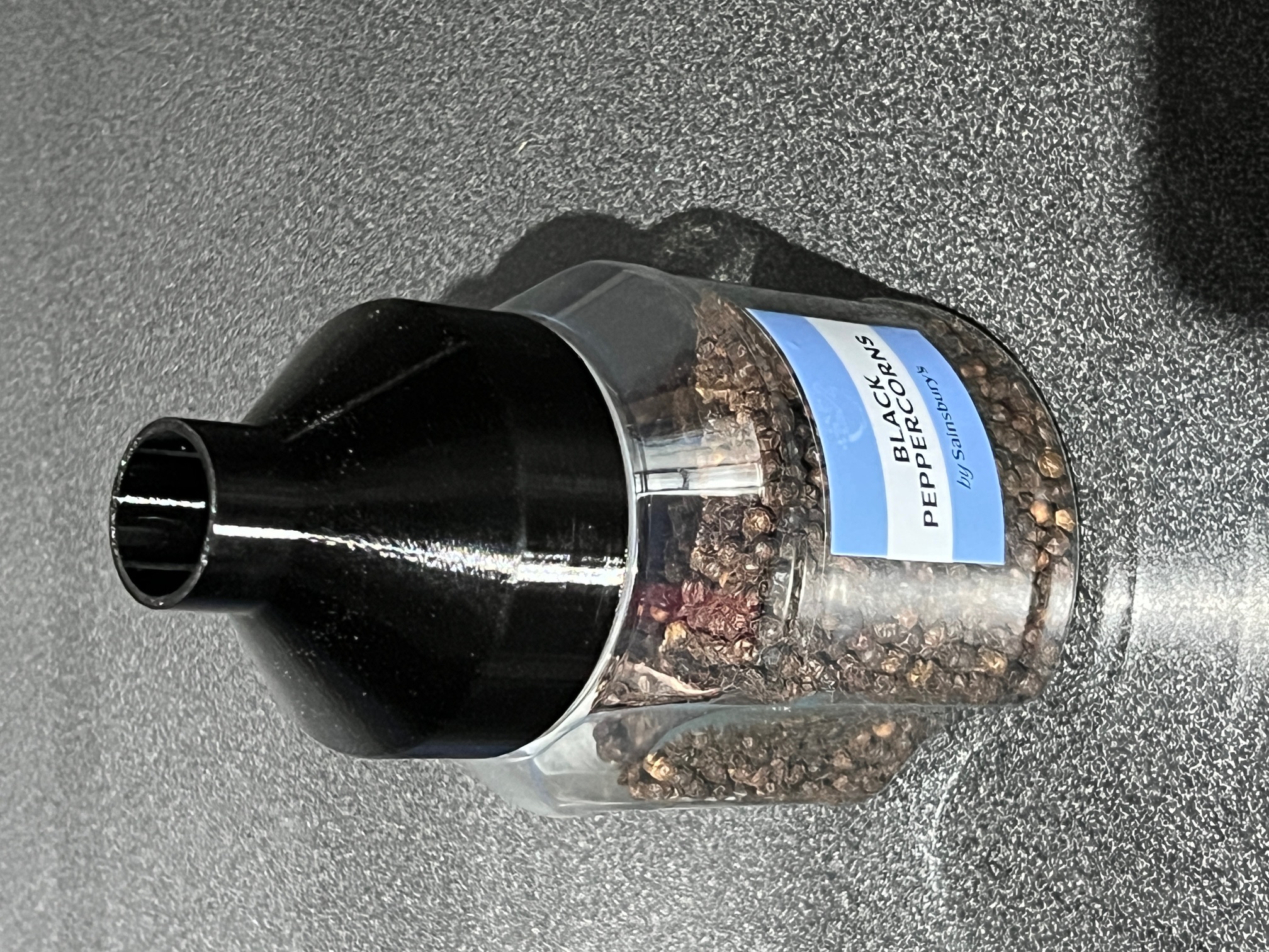 Funnel for Course Salt and Peppercorns that saves storage space and will fit all grinders.