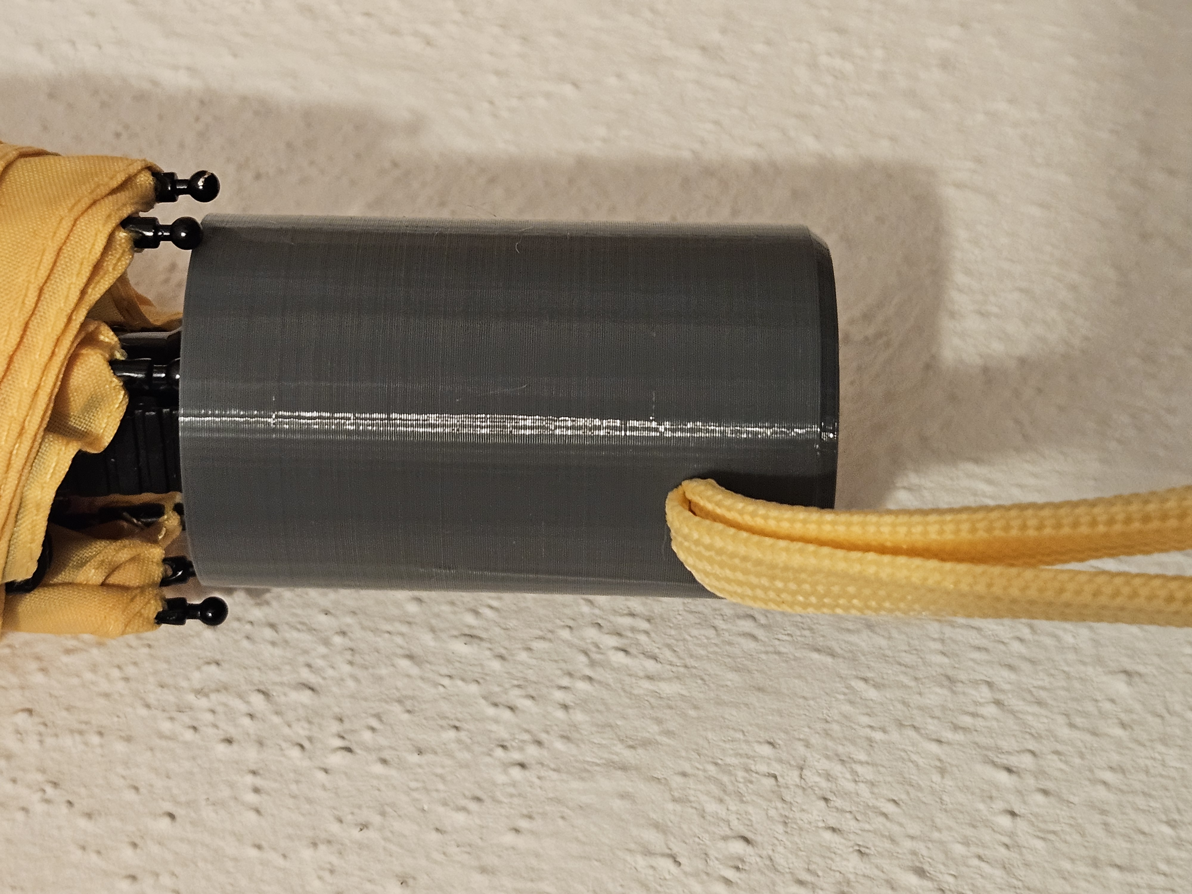 Umbrella handle with strap hole