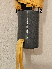 Umbrella handle with strap hole