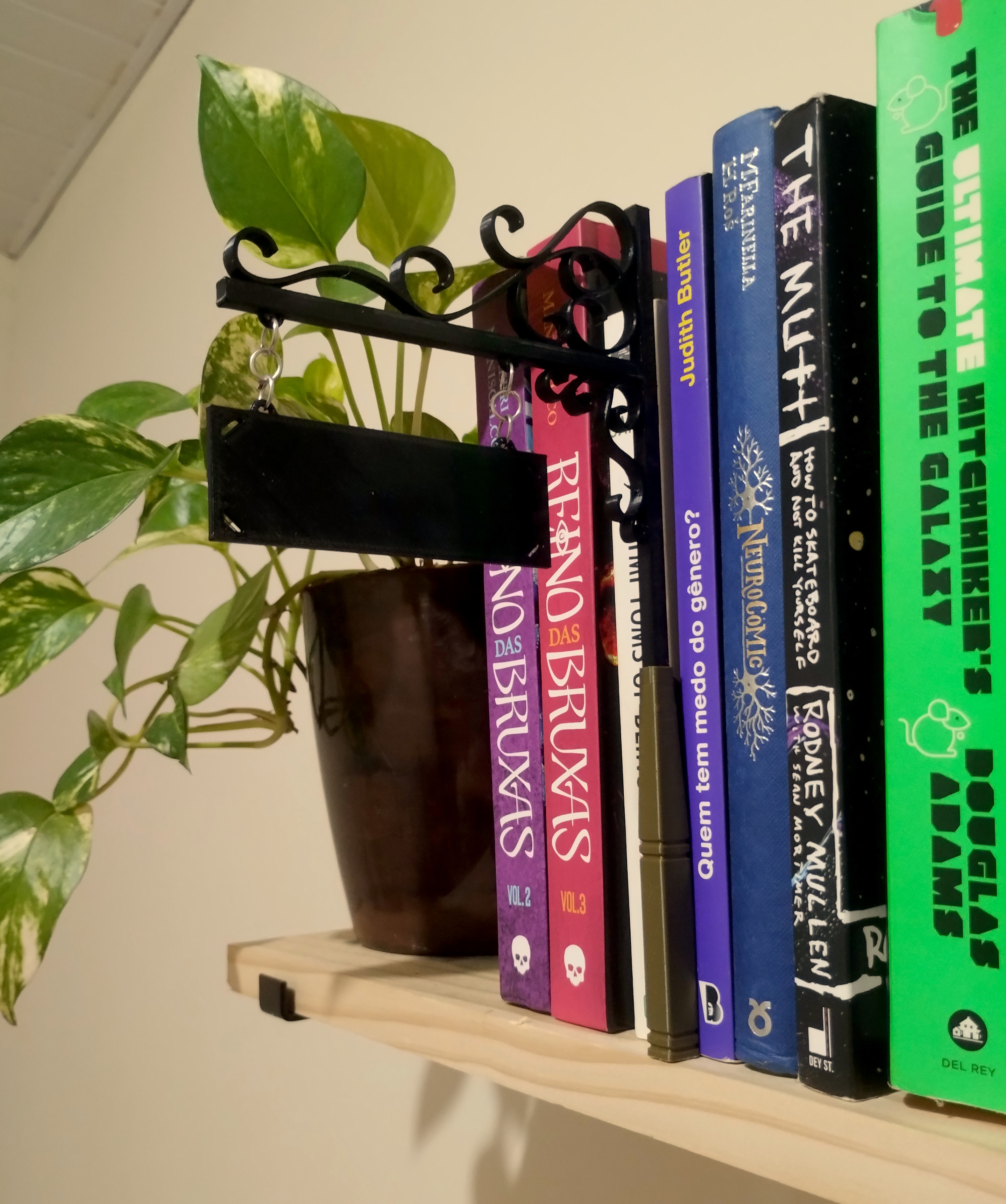 Wrought iron book end - book genre sign separator