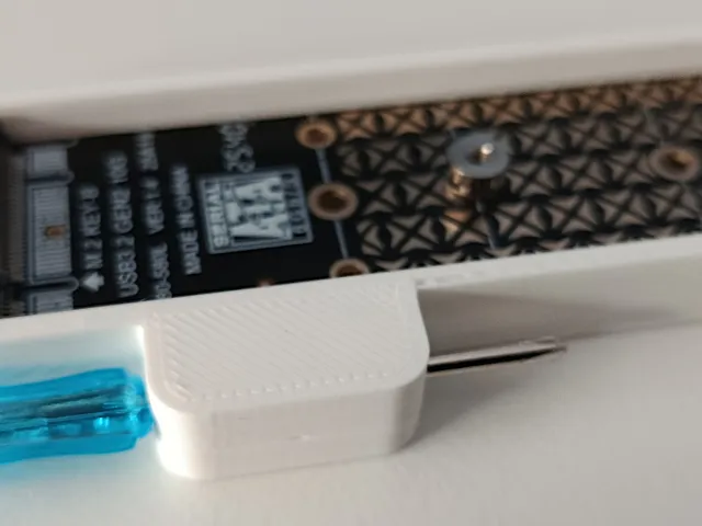 Holder for AliExpress USB to M.2 adaptor with screwdriver storage