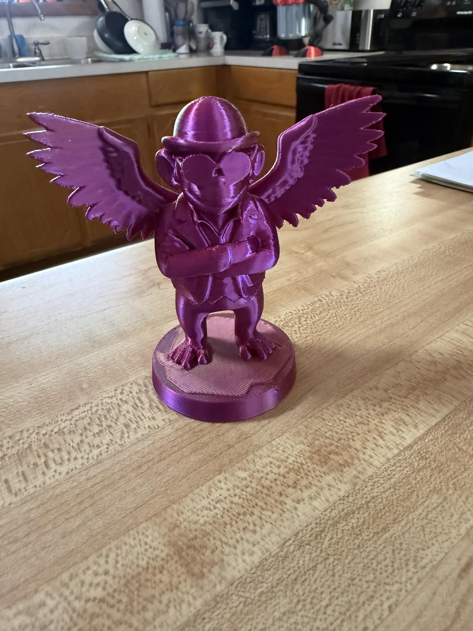 Flying Monkey Dressed wearing a Derby Hat and Sunglasses