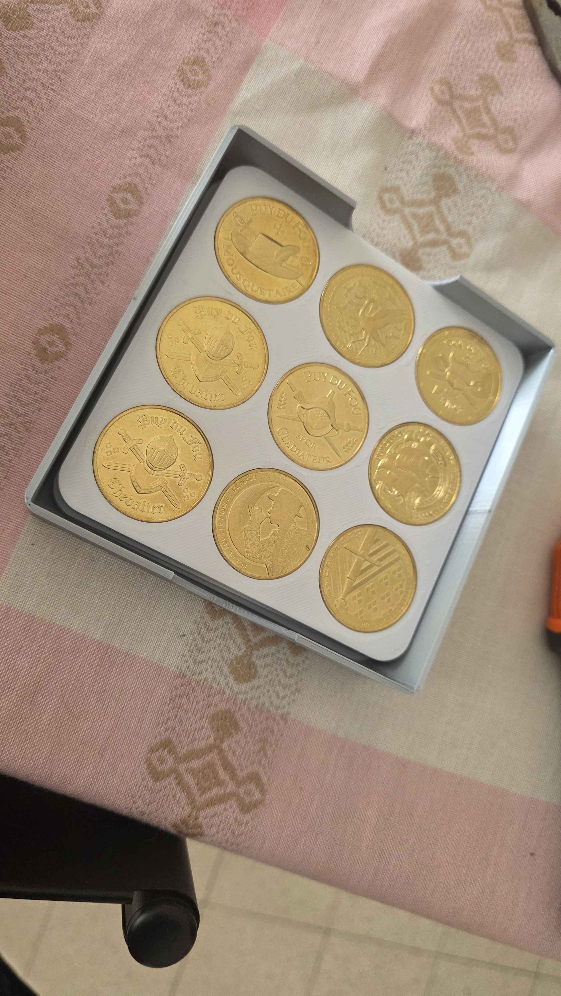 tray for storing the coin plates