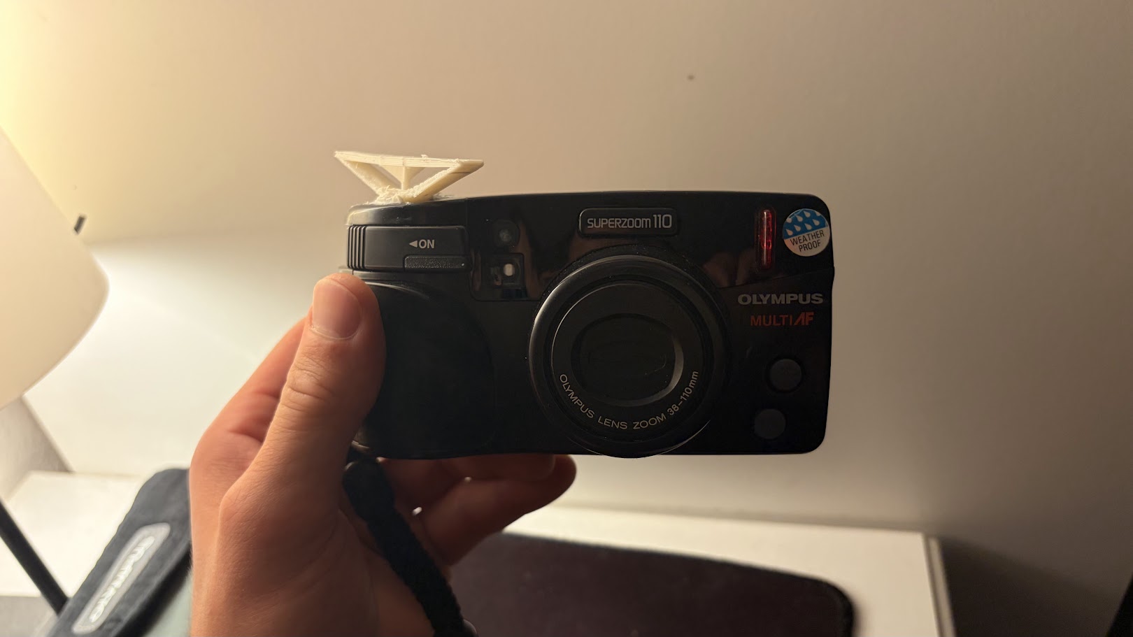 Olympus Superzoom 110 replacement button