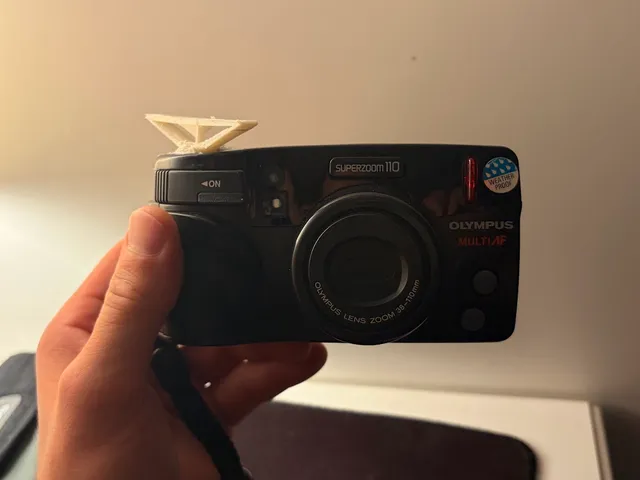 Olympus Superzoom 110 replacement button