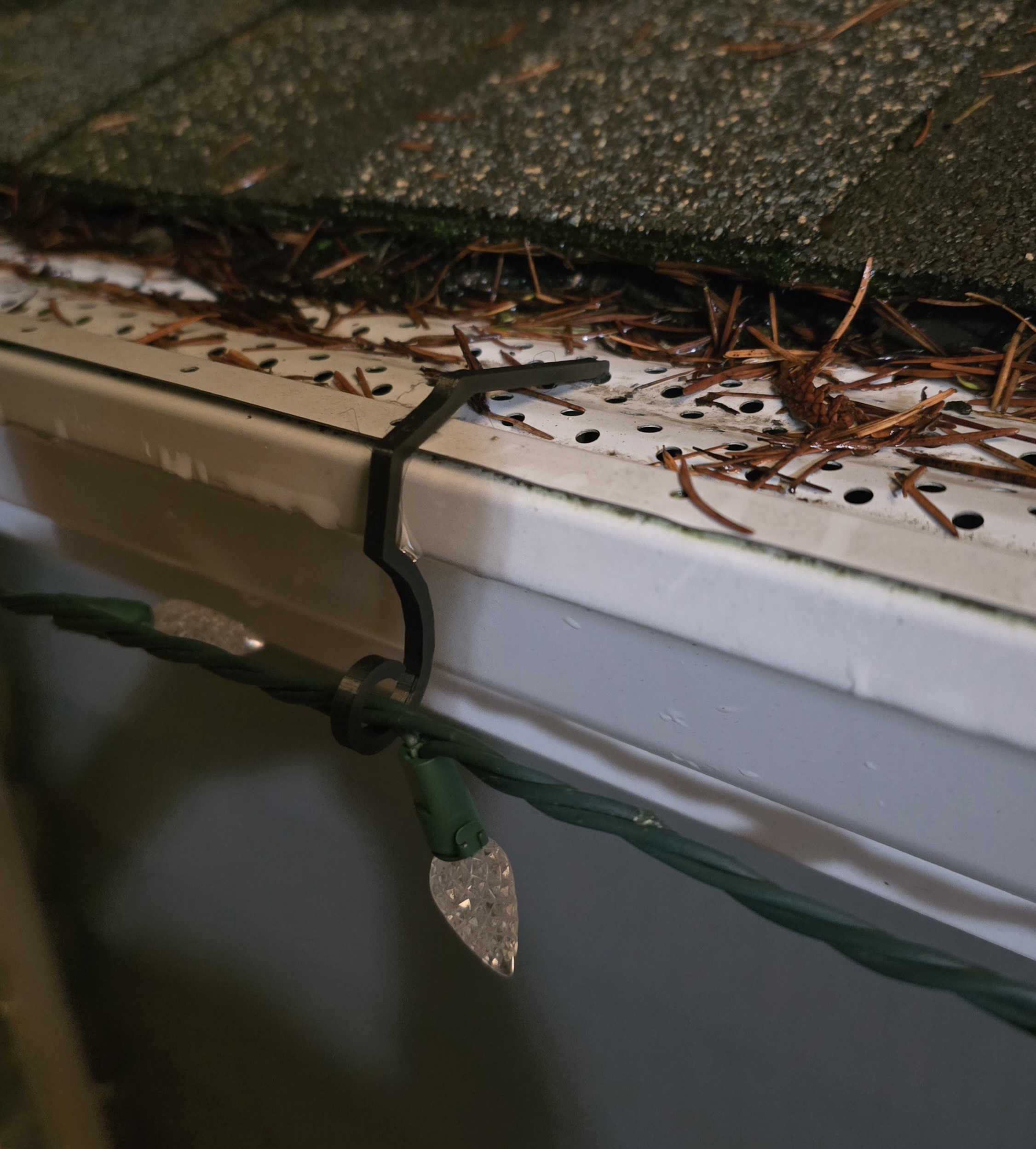Christmas gutter light clip for a BullDog leaf guard