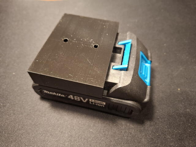 Wall-mounted battery holder