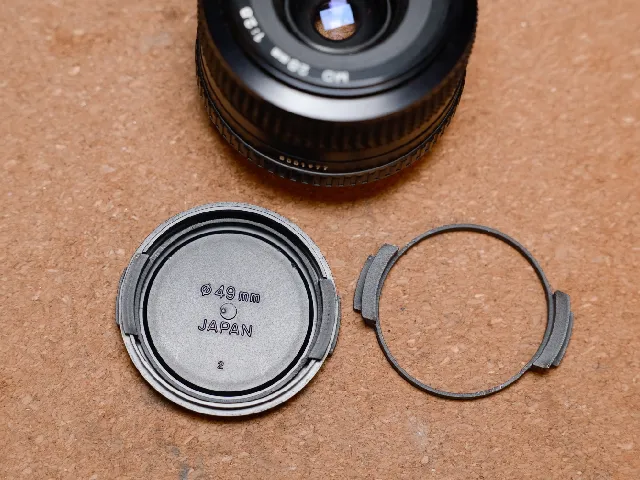 Minolta Lens Cap Replacement Squeezy Bit, 49mm