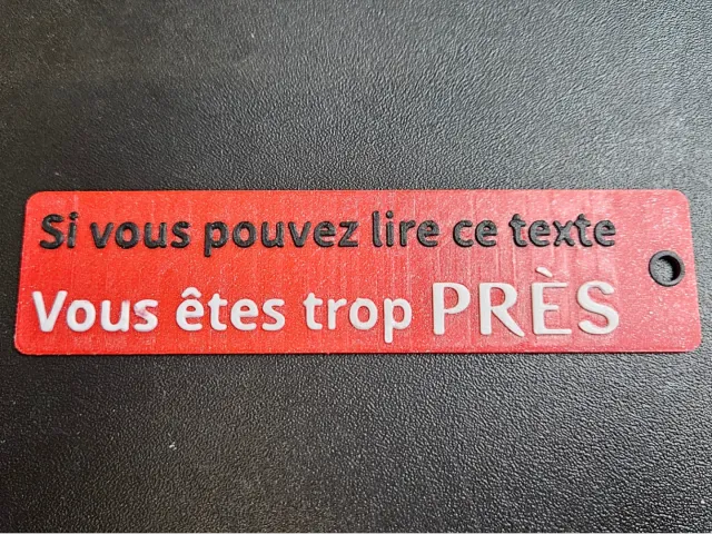 Porte clé flamme "Si vous pouvez lire ce texte"