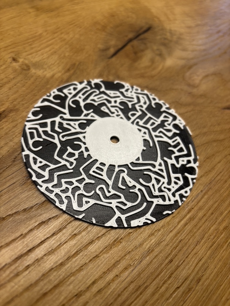Vinyl record-style coaster inspired by Keith Haring