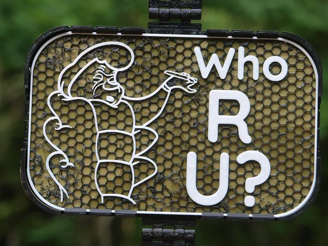 Caterpillar "Who R U?" sign