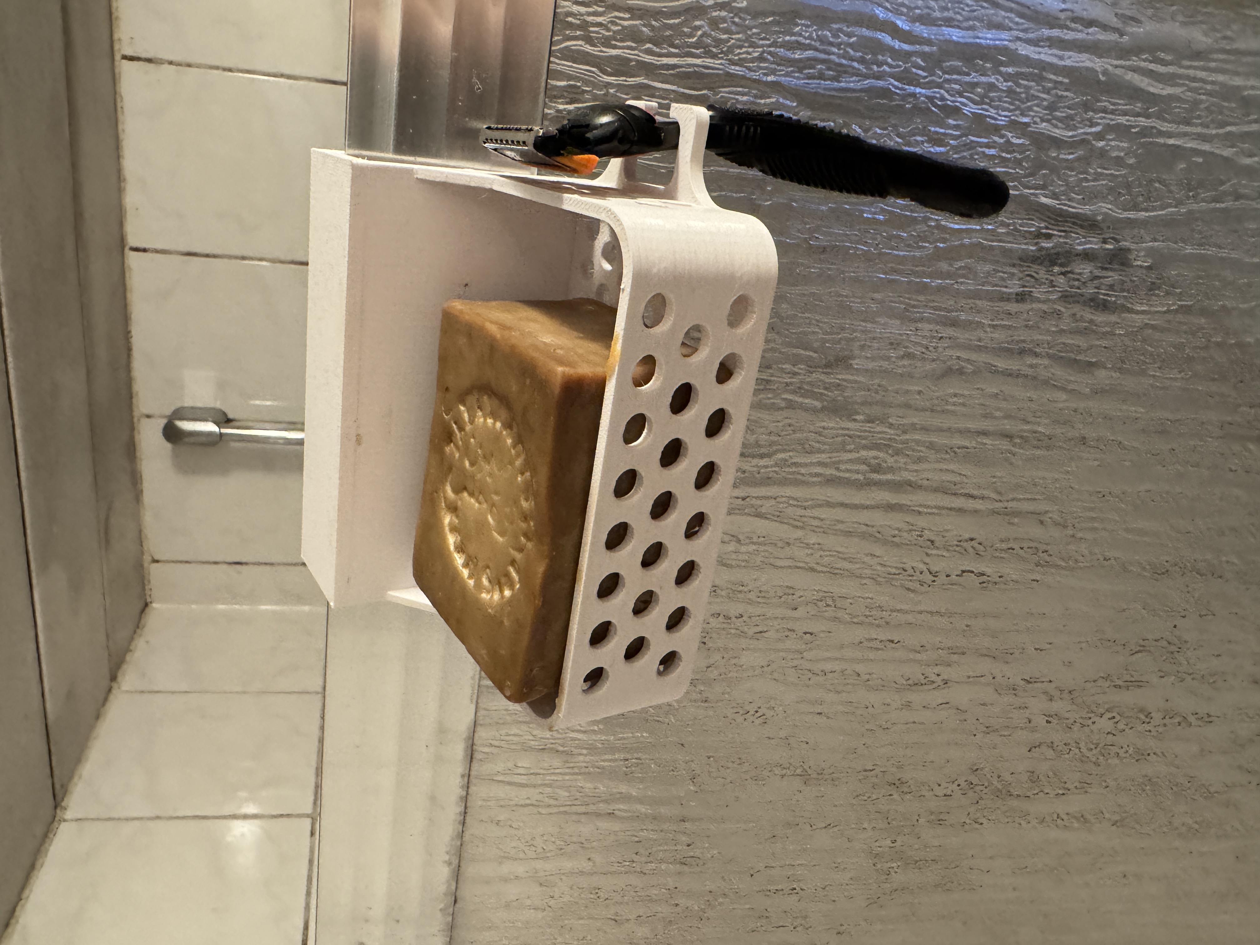 Soap and razor holder for shower enclosure