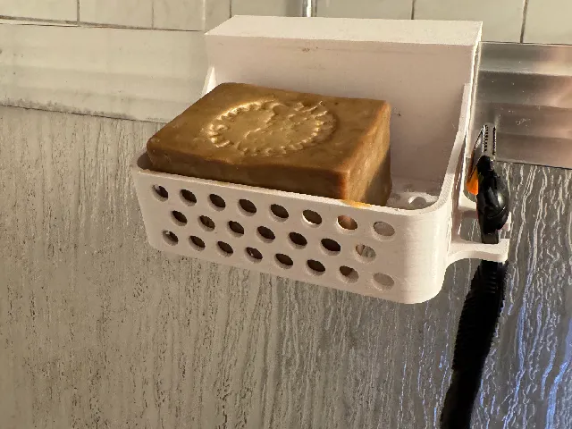 Soap and razor holder for shower enclosure