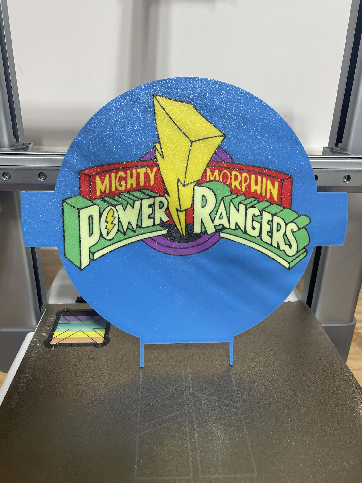 Floor plate with “Migthy Morphin” logo