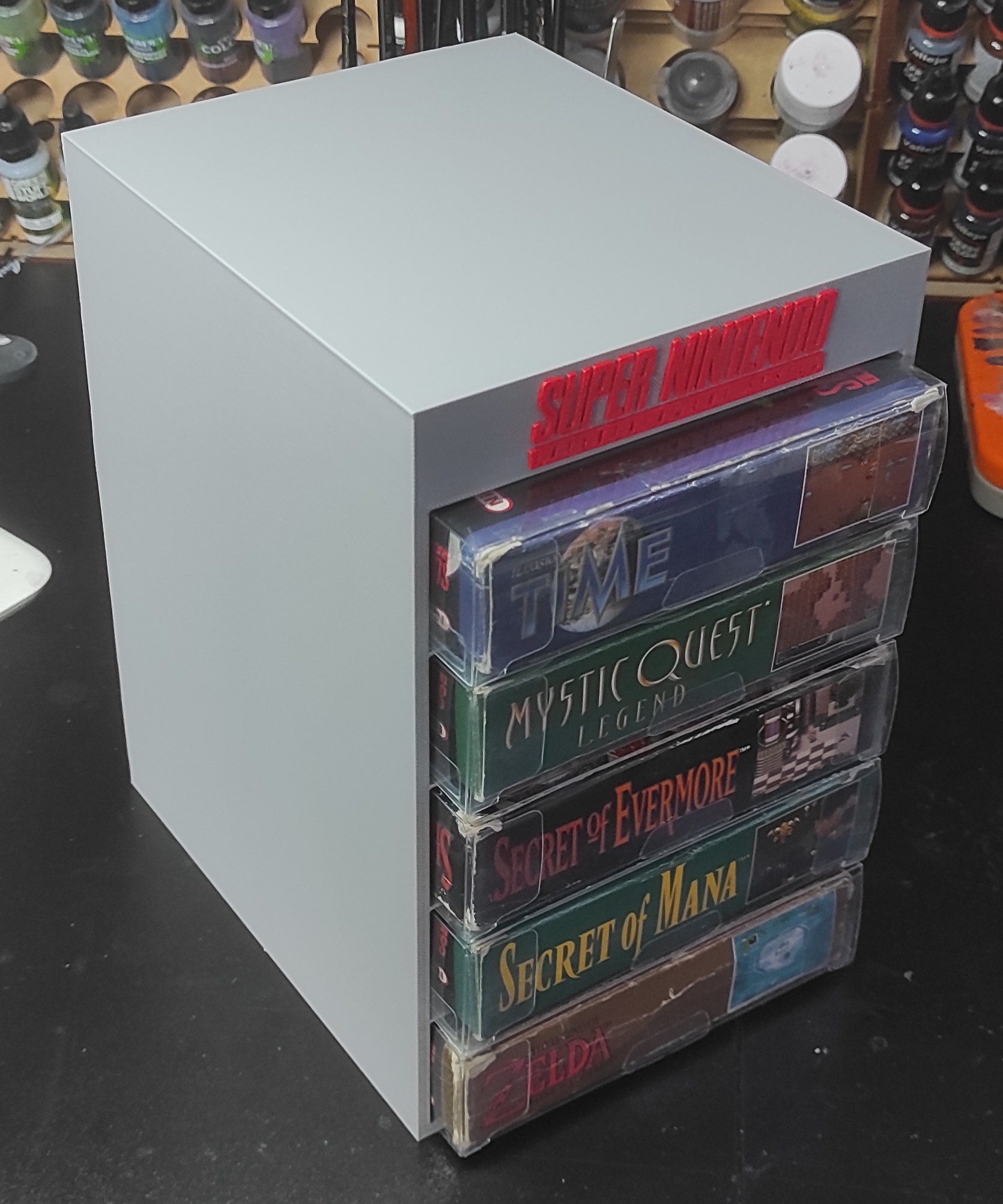 Vertical game stand for Super Nintendo.