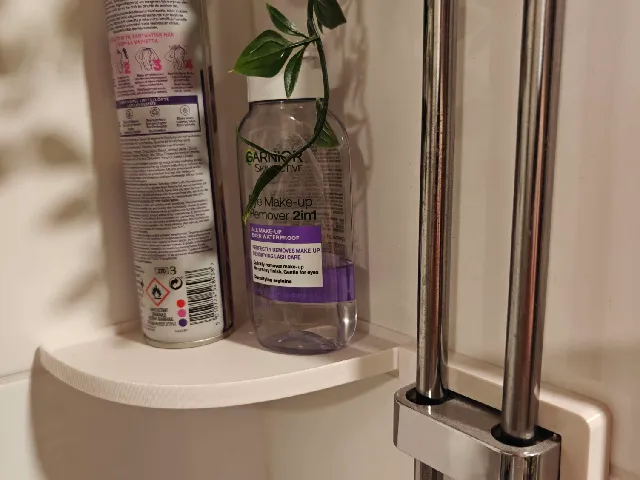 Bathroom corner shelf utilizes pipe mounts