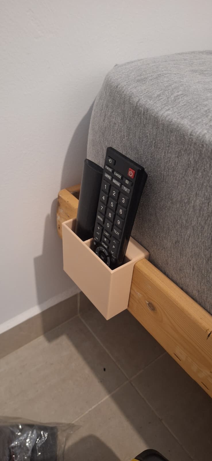 Bed side remotes organizer