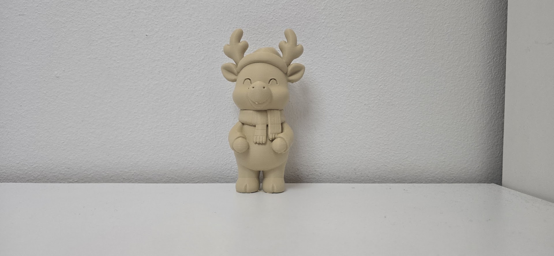 Smiling Reindeer in Hat and Scarf Christmas Figure