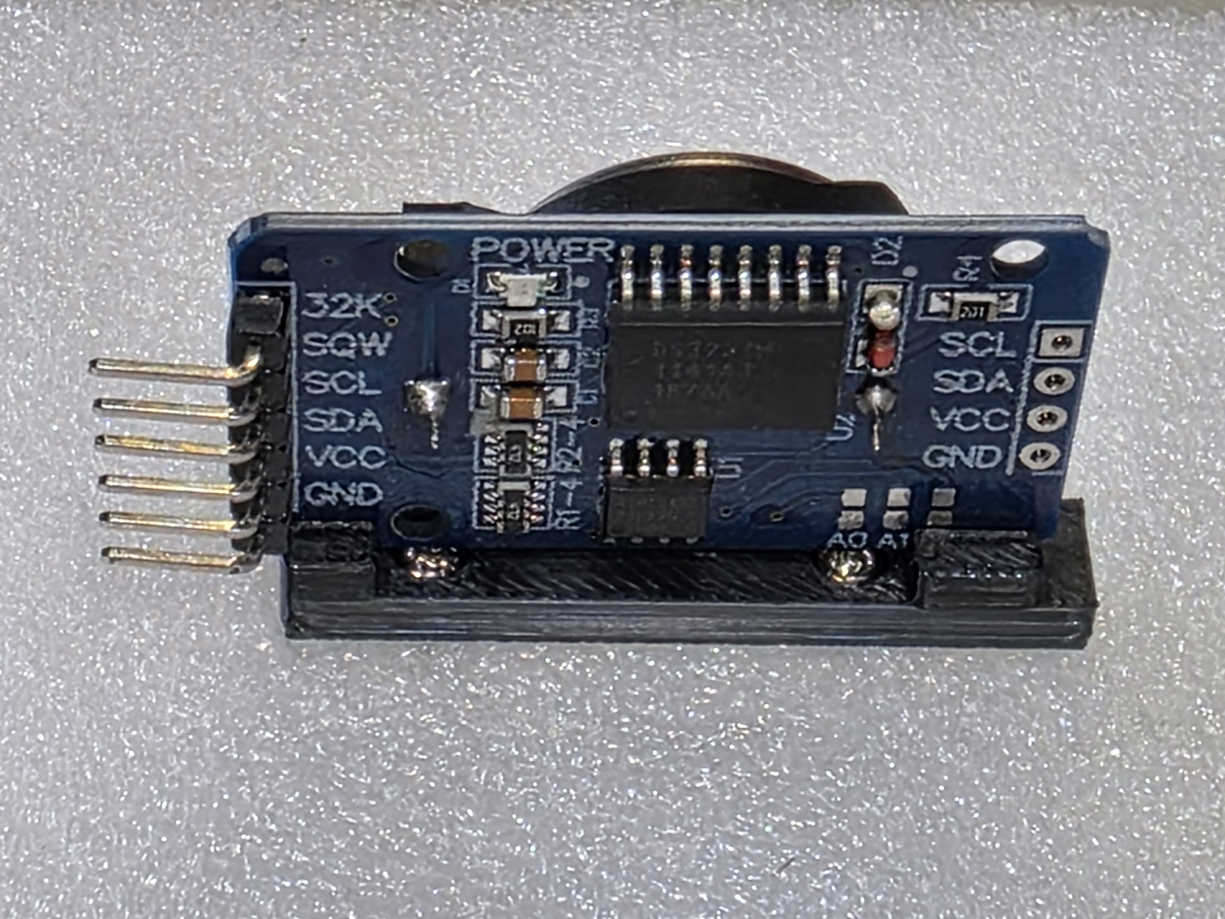 Remix of DS3231 Side Mount by edringel | Adds screw holes