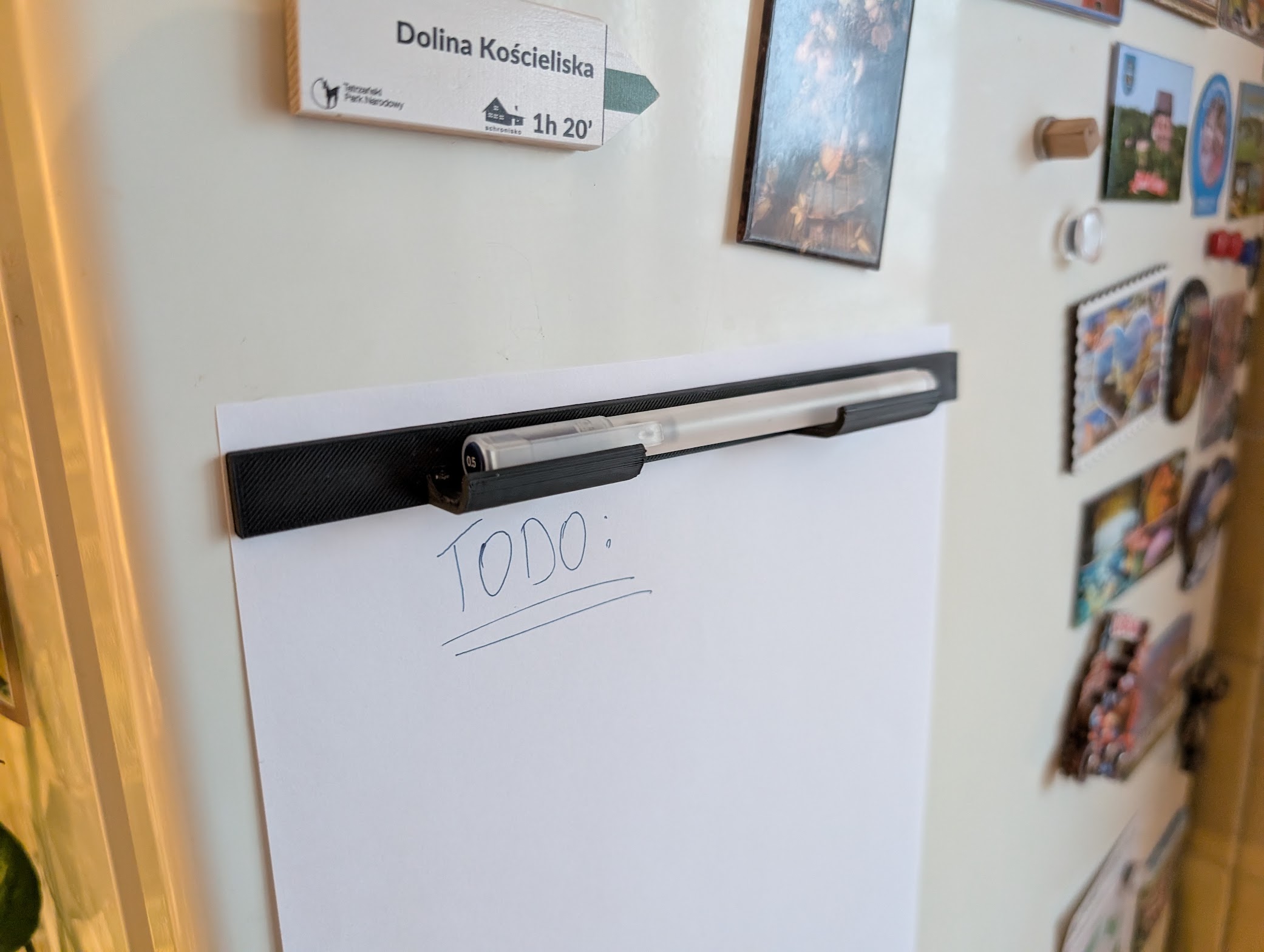 Magnetic fridge note and pen holder