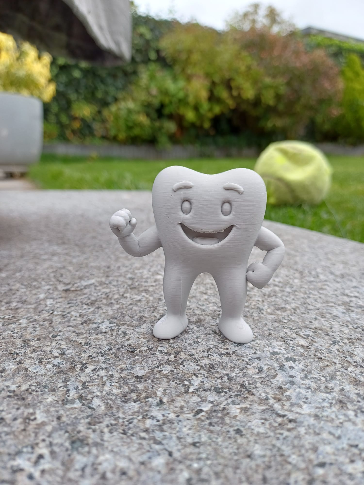 Toothy the happy tooth.