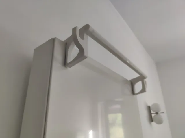Radiator towel hanger with side hooks