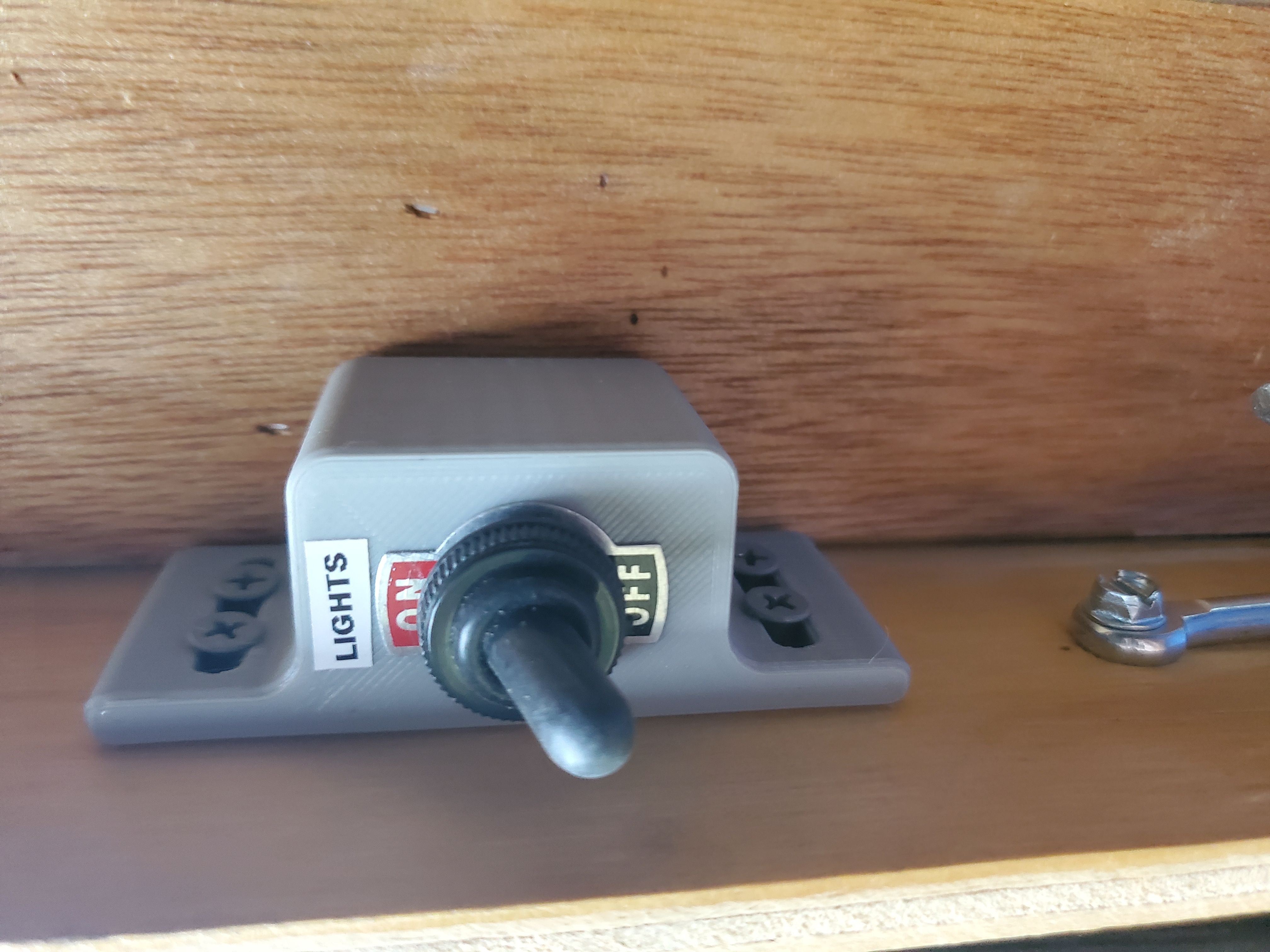 Toggle switch holder for trailer lights