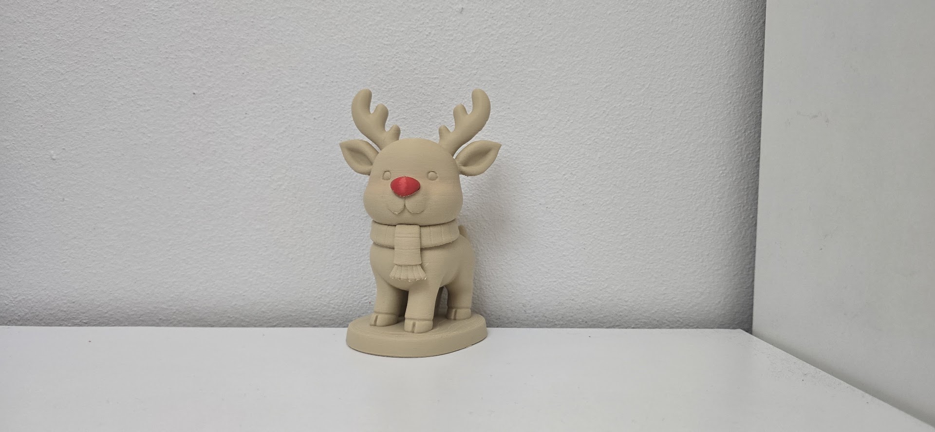 Cute Sitting Reindeer with Red Nose and Scarf Christmas Figurine
