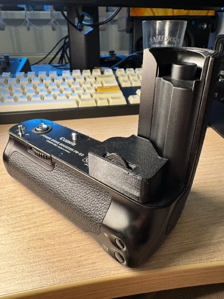 Contact cover for the Canon PB-E2 motor drive booster grip for EOS